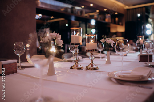 bohemian boho decor with candles on the wedding banquet table © Юлия Чернецкая