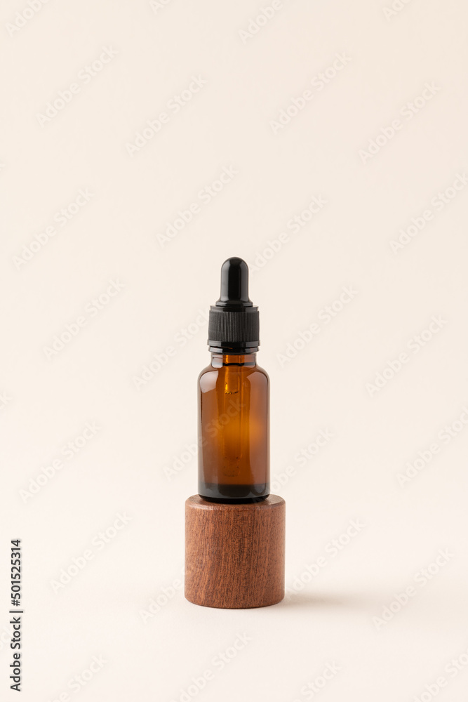 Mock up amber glass bottle on wooden podium on trendy beige background. Dropper glass, minimal concept of beauty spa salon, body care, natural skincare cosmetics, product display presentation Mock up amber glass bottle on wooden podium on trendy beige background. Dropper glass, minimal concept of beauty spa salon, body care, natural skincare cosmetics, product display presentation