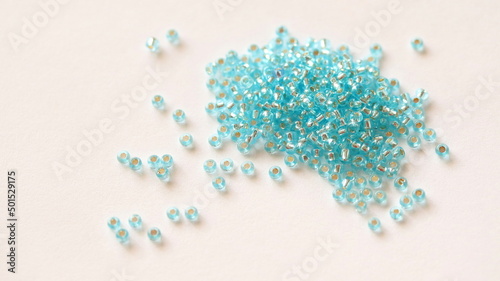 Glass beads. Light blue color. Isolated on white background.