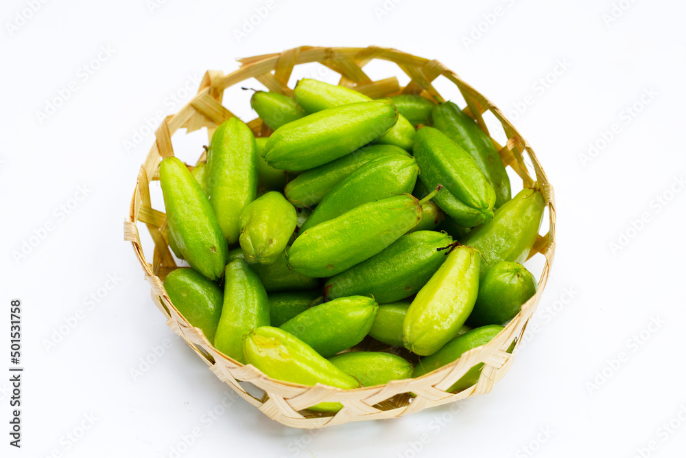Bilimbi fruit in bamboo basket on white background. Bilimbi fruit in bamboo basket on white background.