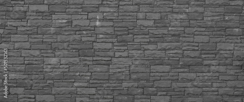 old masonry black stone wall