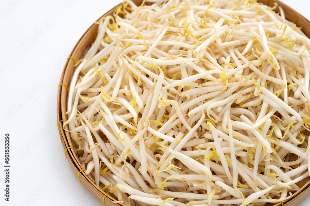Bean sprouts in bamboo basket on white background