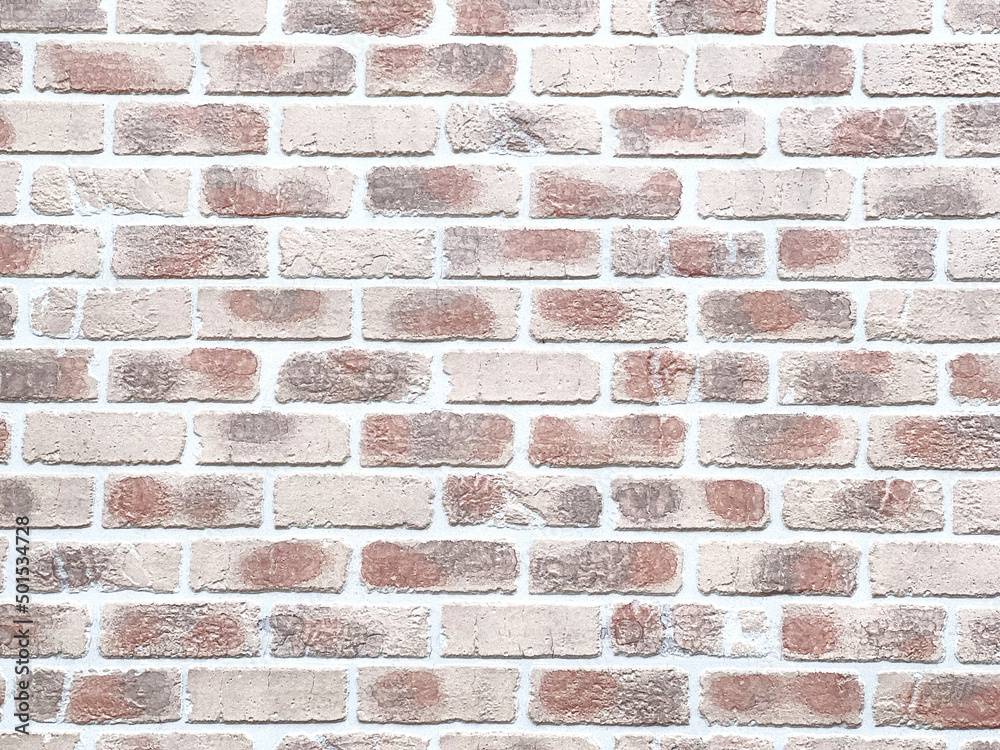 Fototapeta premium ムラのあるベージュ色のレンガ背景