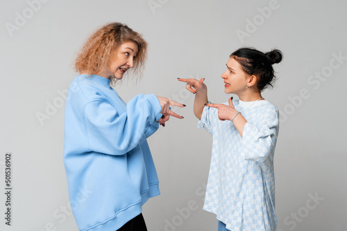 Mid aged mother scold teen daughter daughter, angry mom tell complaints lecturing teen adult child feeling stressed, misunderstandings, generational gap, difficulties in relationships concept