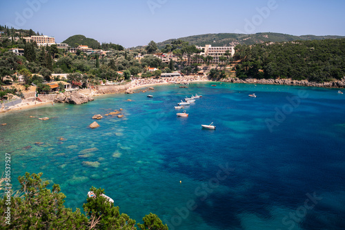 Paleokastritsa bay on sunny day. Bay with beautiful turquoise water and boats.