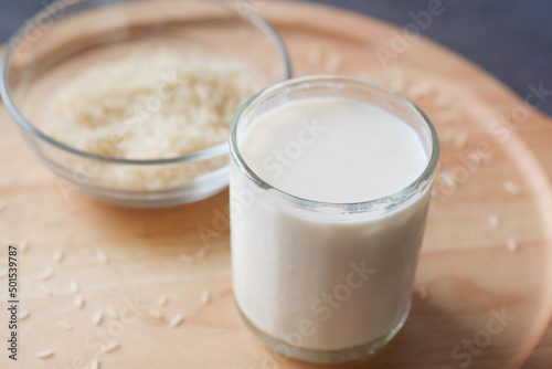 glass of milk and rice on a table, non dairy milk concept 