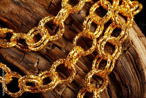 Golden jewel chain over a black background