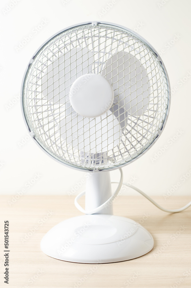 Table fan. Closeup. Cooling in the room in hot weather Table fan. Closeup. Cooling in the room in hot weather
