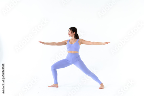 young woman practicing yoga on white background