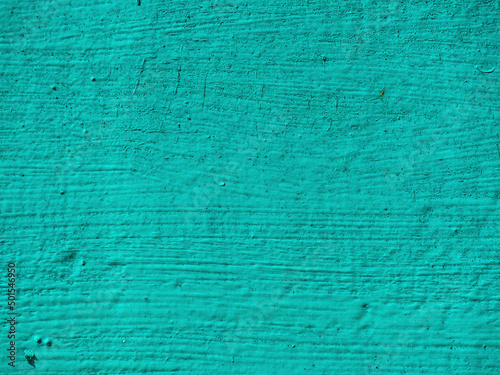 Abstract textured turquoise background. Rough painted surface of blue-green (aquamarine) color