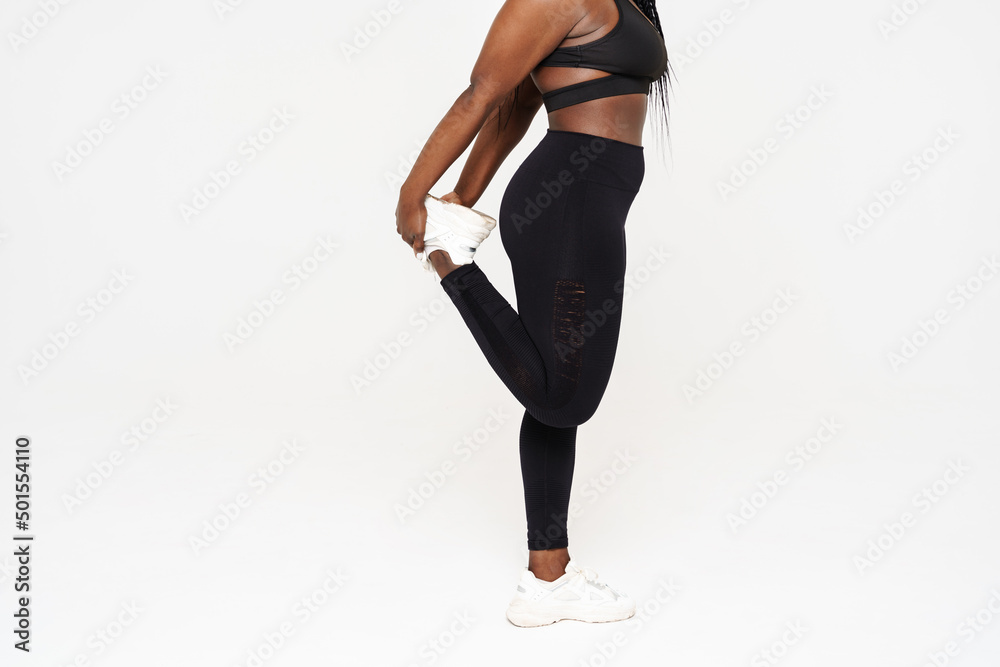 Young black sportswoman doing exercise while working out Young black sportswoman doing exercise while working out