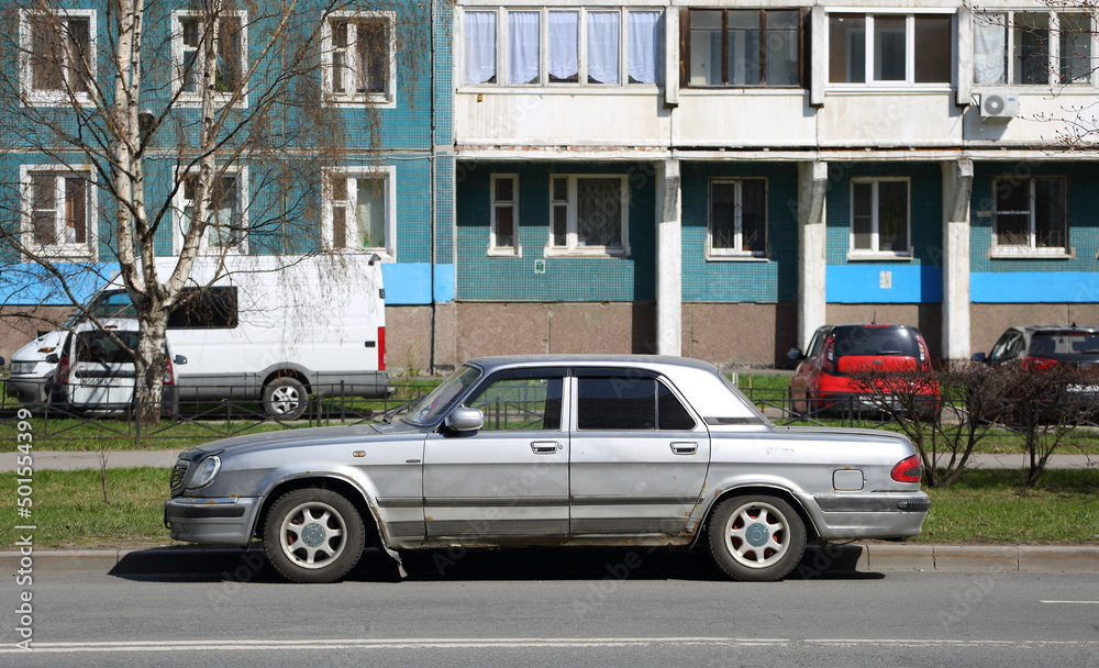 Old rusty Soviet car on the street, Iskrovsky Prospekt, Saint Petersburg, Russia, April 2022