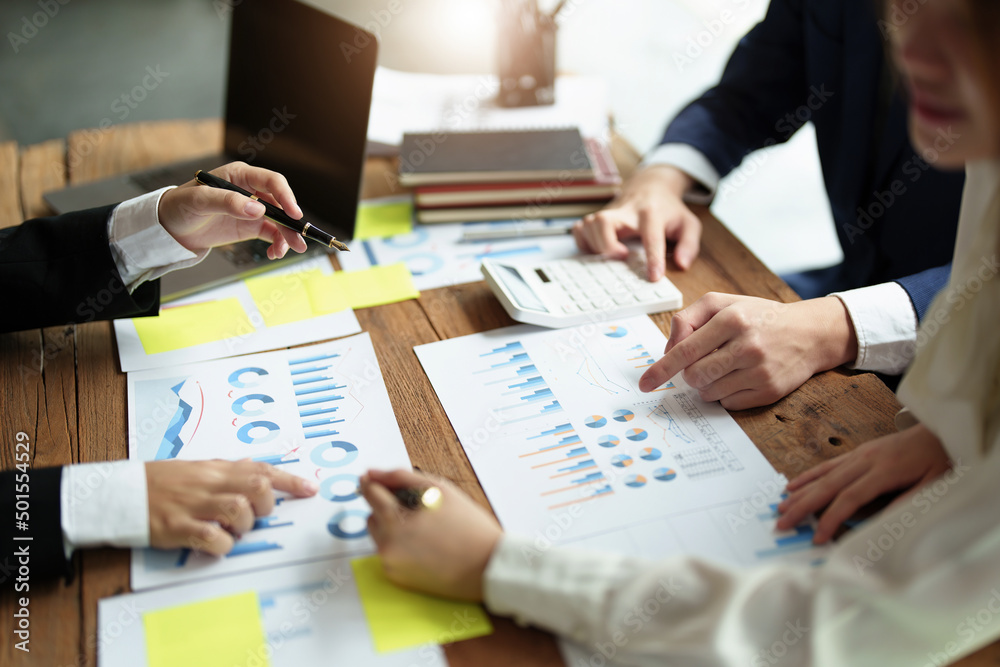 financial, Brainstorming, Consulting, Data Analysis, Planning, Marketing and Accounting, Economist pointing to investment documents with partners on profit taking to compete with other companies. financial, Brainstorming, Consulting, Data Analysis, Planning, Marketing and Accounting, Economist pointing to investment documents with partners on profit taking to compete with other companies.
