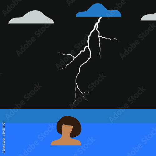 Woman in the sea at night during a thunderstorm