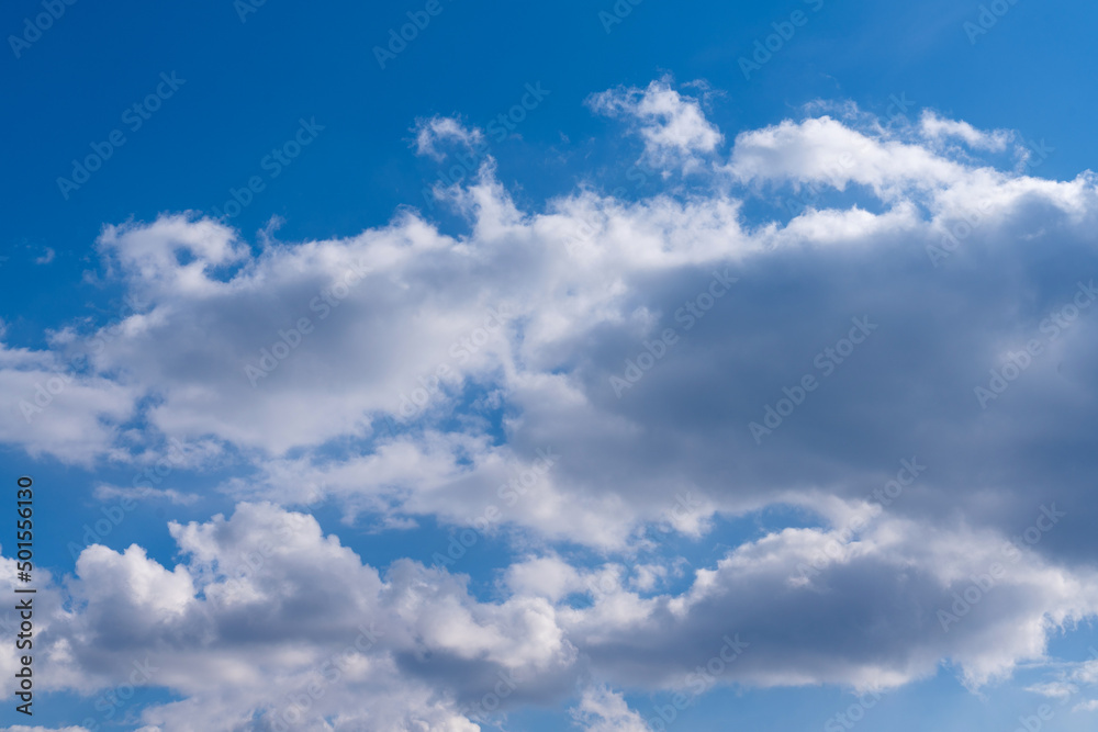 White clouds in the blue sky. Clear heaven on a clear, fine summer day White clouds in the blue sky. Clear heaven on a clear, fine summer day