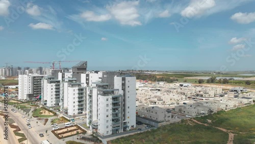 new neighborhood buildings with cranes at netivot city photo