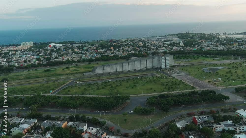 Aerial drone flying towards Columbus lighthouse or Faro Colon at sunset and sea in background, Santo Domingo Aerial drone flying towards Columbus lighthouse or Faro Colon at sunset and sea in background, Santo Domingo