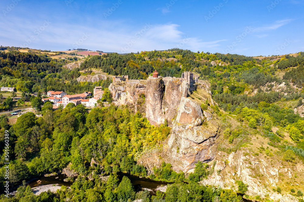 Arlempdes village with its castle on top of a basalt rock at a meander bend of the Loire river. Haute-Loire, France