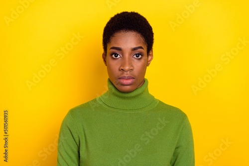 Portrait of attractive brunet content woman wearing warm pullover isolated over bright yellow color background