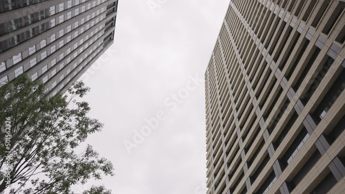Ginza Neighborhood, Looking up at High Rise Buildings, Tokyo Japan photo
