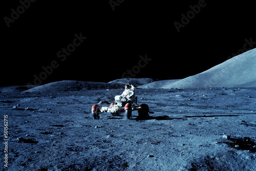 Fototapeta Naklejka Na Ścianę i Meble -  Astronaut on moonrover, on the surface of the moon. Elements of this image furnished by NASA