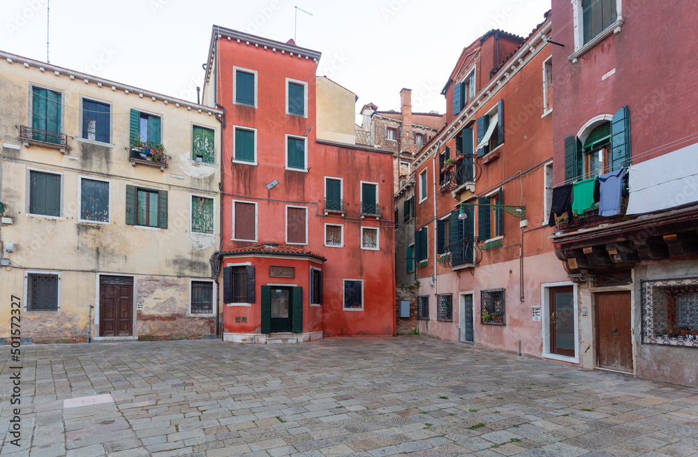 Venice. Old traditional multi-colored stone houses in the historical part of the city.