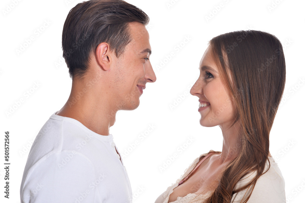 Happy beautiful young couple posing on white background Happy beautiful young couple posing on white background
