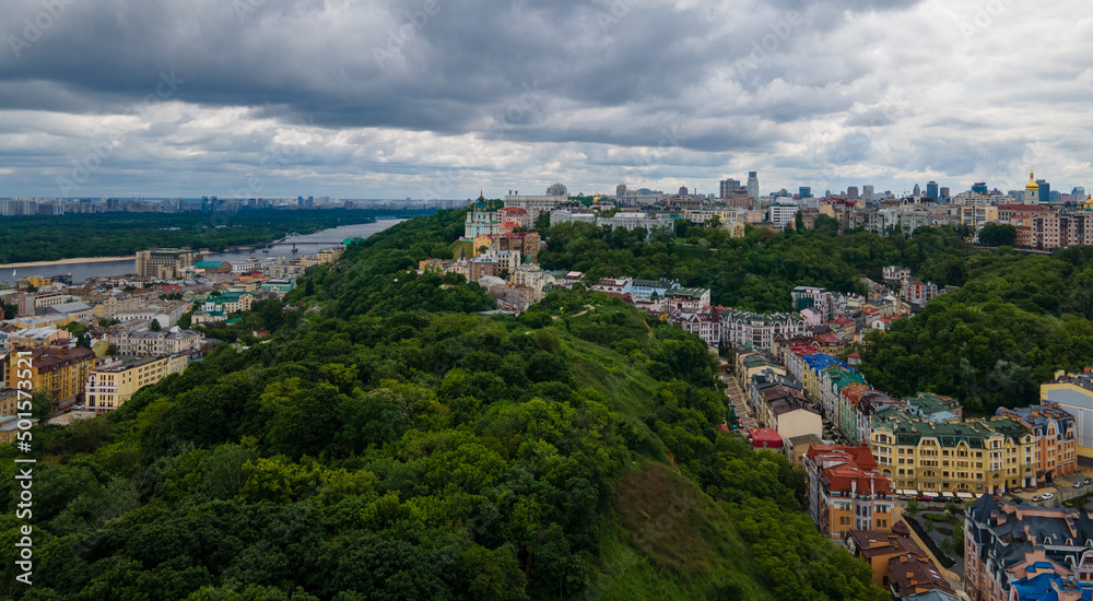 Fototapeta premium Town View with Forested Hills