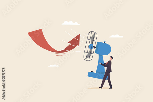 Solve problems in times of crisis, financial crisis or investing, trying to overcome or challenging business. Businessman uses a fan to change the direction of the arrow chart.
