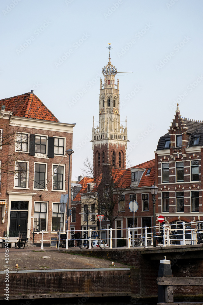 city scape with church tower at Haarlem, the netherlands. Historic city centre without people. Romantic location tourist destination. Traditional dutch buildings. Culture background.