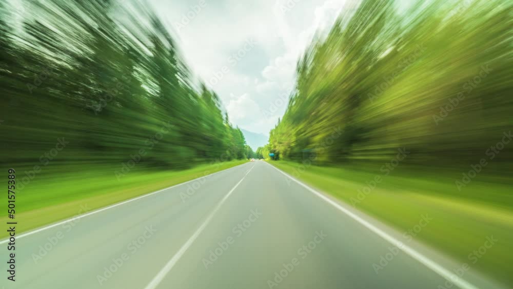 Timelapse of a Speedy Day Drive. View From the Car Windshield to the Country road. Hyperlapse Road Trip Sort of Dashcam POV. Travel Concept