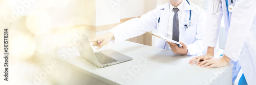 Male and female doctor, good looking, Asian, Thailand. Discussions are discussed in the hospital office about the patient's disease. web banner with copy space on left