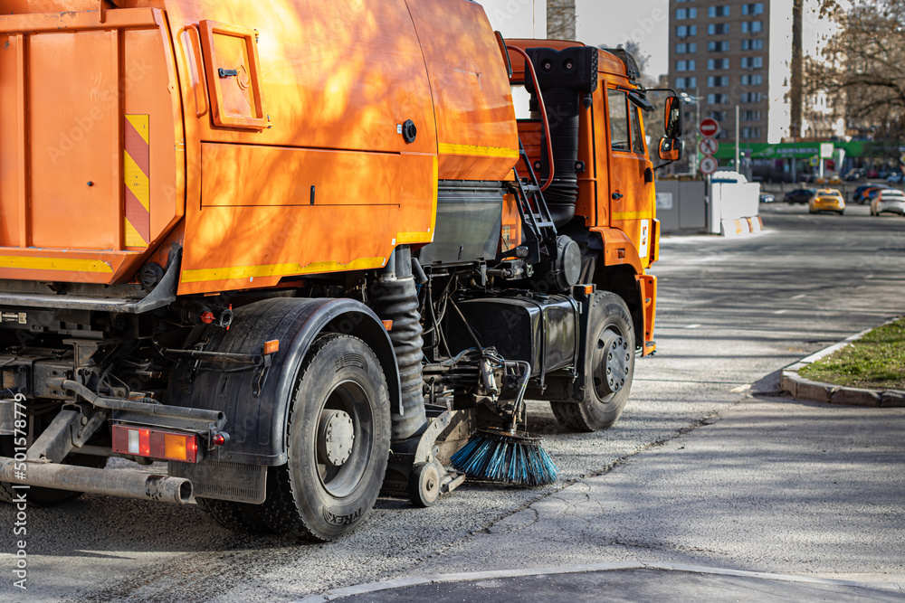  Moscow, Russia - April 20, 2022: a special machine cleans the curb and asphalt