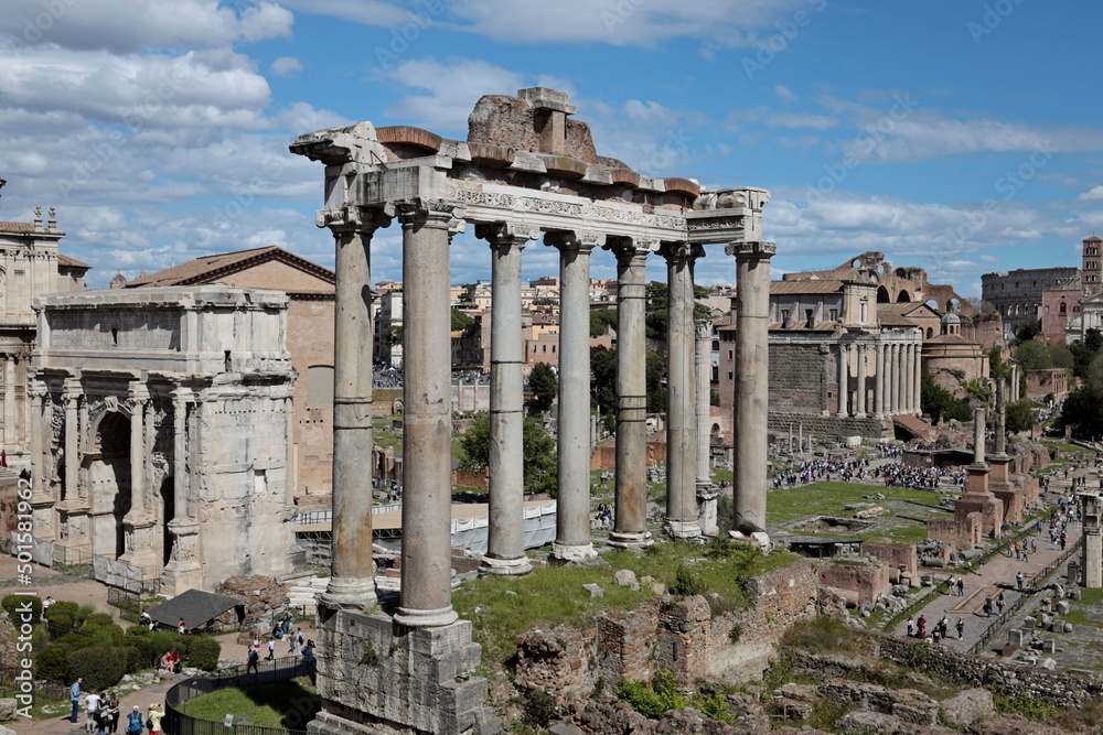 The Roman Forum in Rome with the crowd of tourists visiting the ruins of the ancient imperial city.