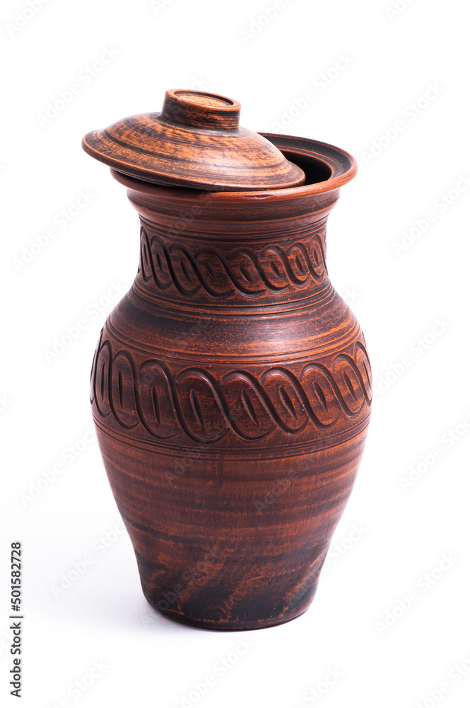 Clay jug with a lid on a white background