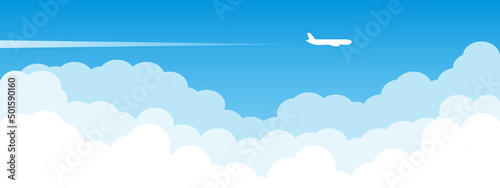 Airplane flying above clouds. Jet plane with exhaust white trail. Blue gradient and white plane silhouette. White and transparent clouds on the blue sky. jpg image