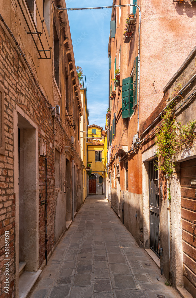 Narrow street in the historical part of Venice, Italy.