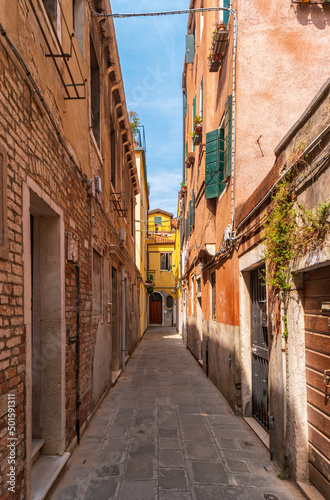 Narrow street in the historical part of Venice  Italy.
