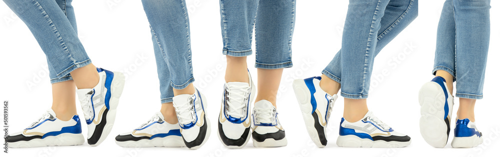 Sneakers on the legs on a white isolated background. Side view from front to back. Shoe display example