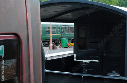 Railway Platform Equipment seen through Old Railway Brake Van and Wheel 