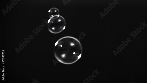 Soap bubble drop or Shampoo bubbles floating like flying in the air black background which represent refreshing moments and gentle soft. Bubbles drops for soap shampoo or detergent product industry.