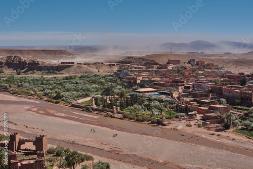 View over Ait-Ben-Haddou in Morocco with a sand storm in the background © Cristina