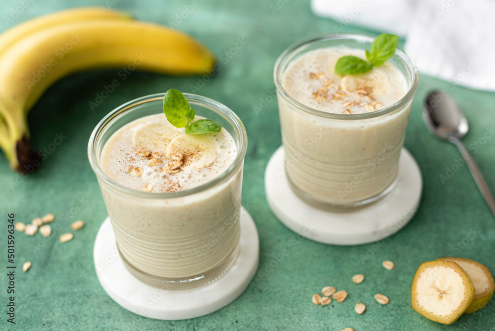 banana milkshake with oatmeal in a glass banana milkshake with oatmeal in a glass