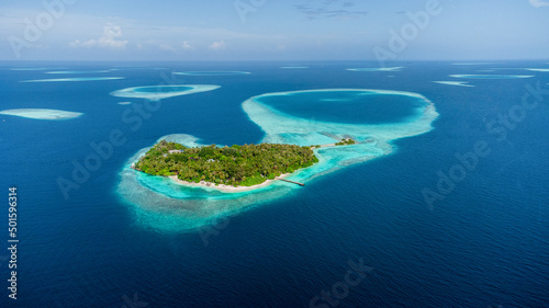 Aerial view to the small islands surrounded by cristal clear waters around Maldives © Gustavo