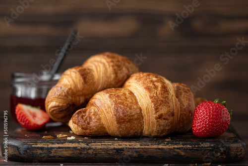 crispy homemade croissants on a wooden board