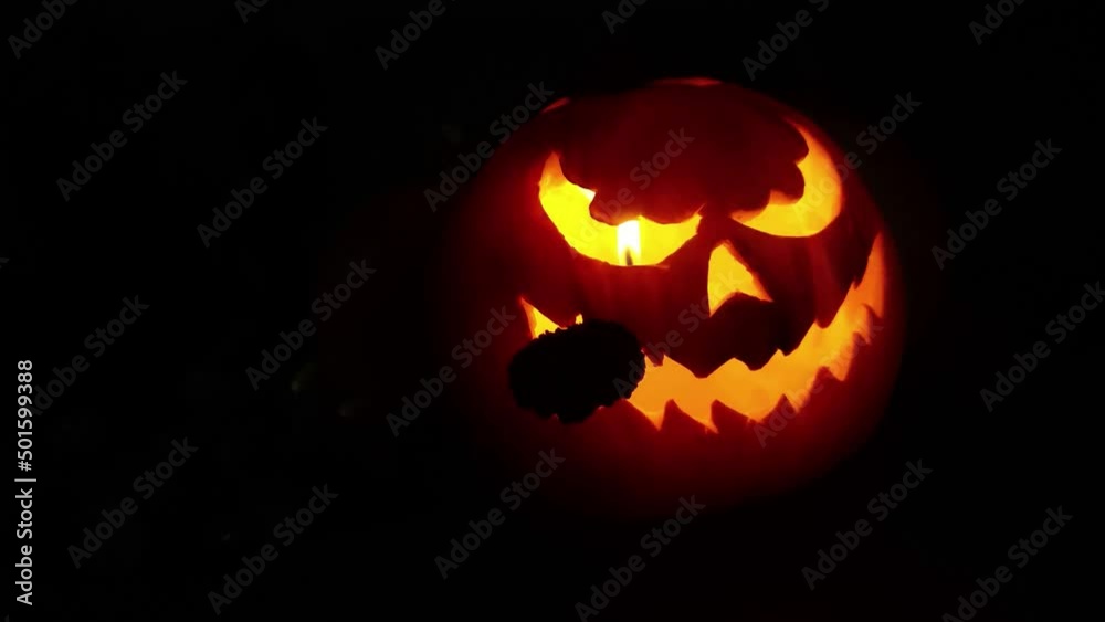 Halloween pumpkin with scary face smoke inside with flame isolated on the black background. High quality FullHD footage Halloween pumpkin with scary face smoke inside with flame isolated on the black background. High quality FullHD footage