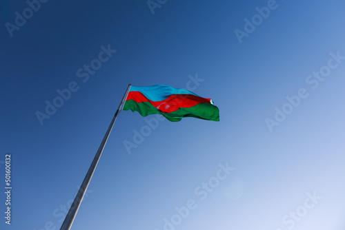 Azerbaijan flag waving on blue sky background