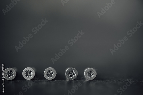chrome screw on a blur black and white background