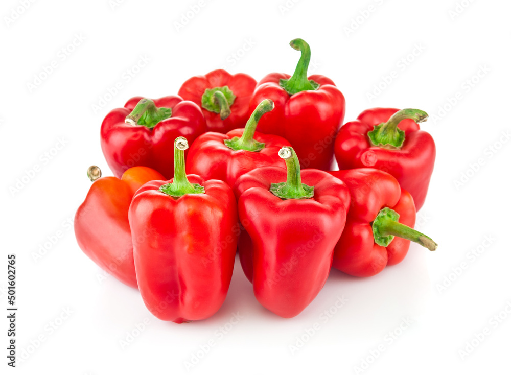 Red ripe peppers close up on white background