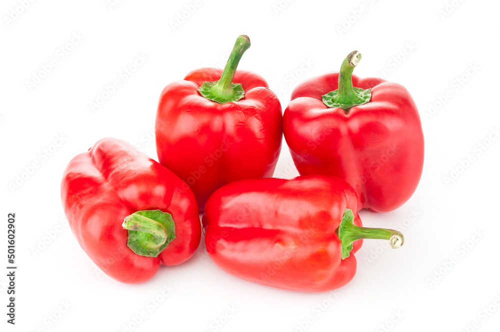 Red ripe peppers close up on white background